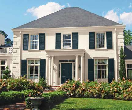 Off White house with dark shutters