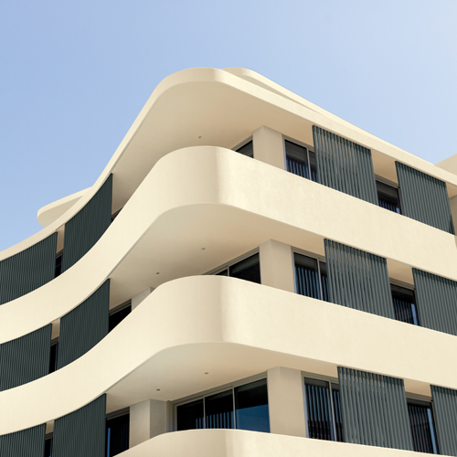 White building exterior with blue skies