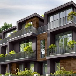 Brown stone and dark brown framing building with back decks all with large potted plants