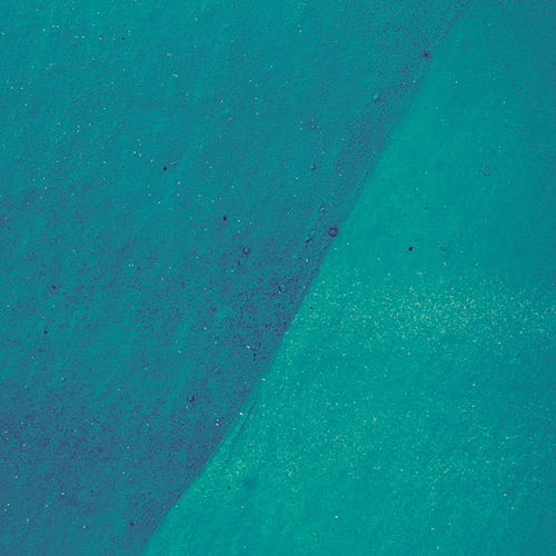 Two slightly different shades of teal next to each other on surface