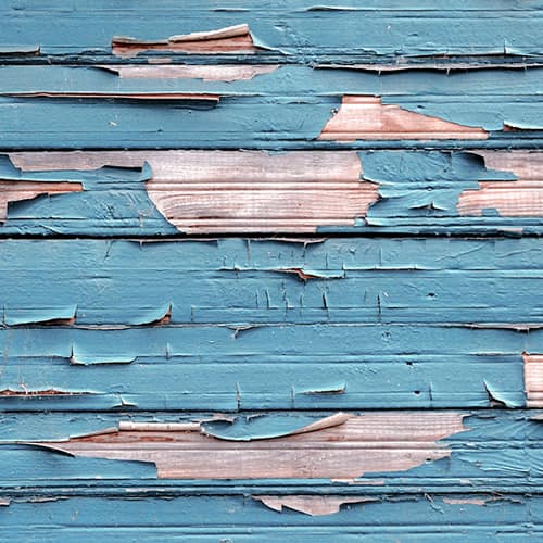 Worn and cracked blue wooden panels